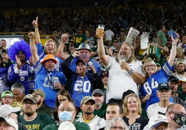 Detroit Lions fans celebrate a touchdown against the Green Bay Packers during the first half at Lambeau Field on September 20, 2021 in Green Bay,...