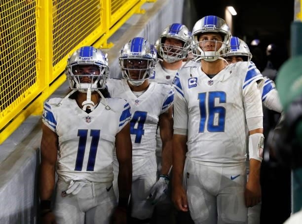 Jared Goff of the Detroit Lions and teammates wait to enter the field against the Green Bay Packers at Lambeau Field on September 20, 2021 in Green...