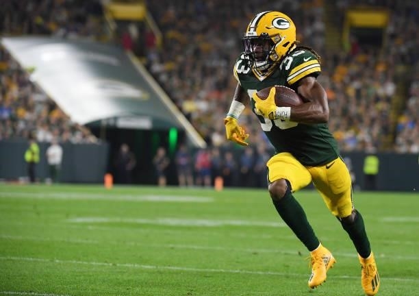 Aaron Jones of the Green Bay Packers runs against the Detroit Lions during the first half at Lambeau Field on September 20, 2021 in Green Bay,...