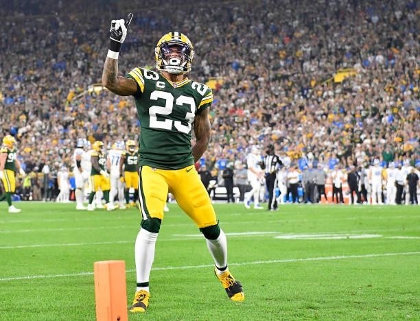 Jaire Alexander of the Green Bay Packers reacts after breaking up a pass against Amon-Ra St. Brown of the Detroit Lions during the first half at...