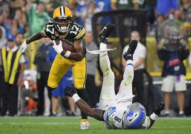 Davante Adams of the Green Bay Packers runs against Jamie Collins of the Detroit Lions during the second half at Lambeau Field on September 20, 2021...