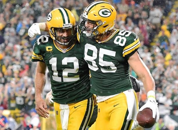 Robert Tonyan of the Green Bay Packers and Aaron Rodgers celebrate a touchdown against the Detroit Lions during the second half at Lambeau Field on...