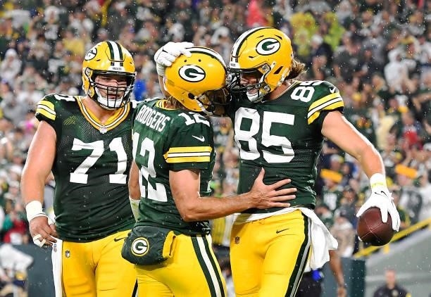 Robert Tonyan of the Green Bay Packers and Aaron Rodgers celebrate a touchdown against the Detroit Lions during the second half at Lambeau Field on...
