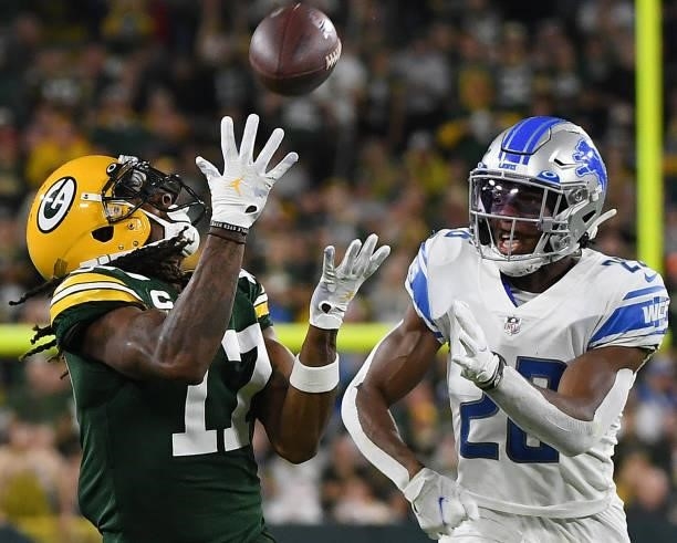 Davante Adams of the Green Bay Packers catches a pass against Ifeatu Melifonwu of the Detroit Lions during the second half at Lambeau Field on...