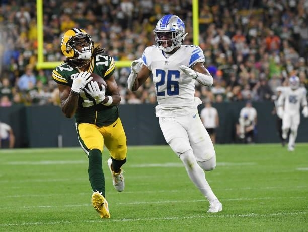 Davante Adams of the Green Bay Packers catches a pass against Ifeatu Melifonwu of the Detroit Lions during the second half at Lambeau Field on...