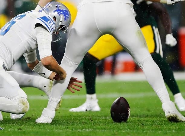 Jared Goff of the Detroit Lions fumbles the ball against the Green Bay Packers during the second half at Lambeau Field on September 20, 2021 in Green...