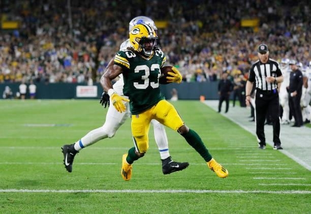 Aaron Jones of the Green Bay Packers scores a touchdown against the Detroit Lions during the second half at Lambeau Field on September 20, 2021 in...