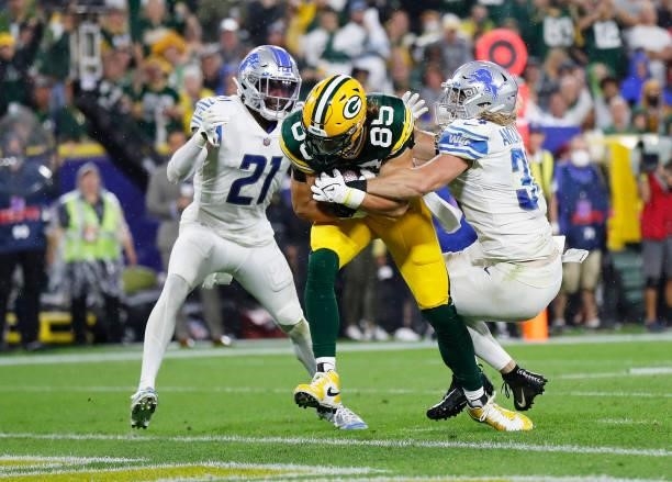 Robert Tonyan of the Green Bay Packers scores a touchdown against Tracy Walker III and Alex Anzalone of the Detroit Lions during the second half at...