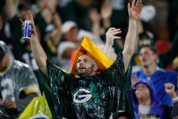 Green Bay Packers fan cheers in the rain against the Detroit Lions during the second half at Lambeau Field on September 20, 2021 in Green Bay,...