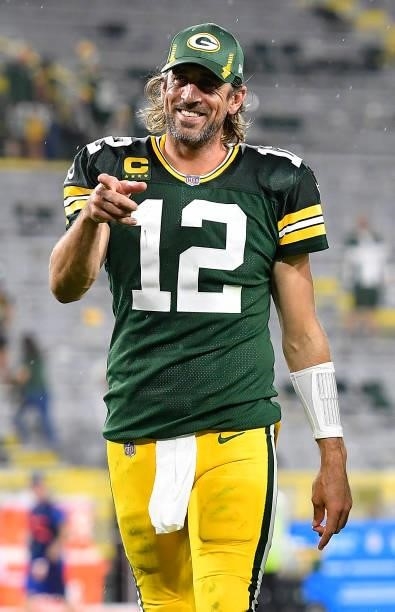 Aaron Rodgers of the Green Bay Packers reacts as he walks of the field following the team's win against the Detroit Lions during an NFL football game...