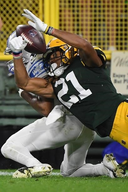 Eric Stokes of the Green Bay Packers breaks up a pass intended for Trinity Benson of the Detroit Lions during the second half at Lambeau Field on...