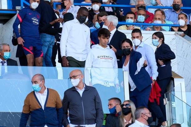 Joao Felix and Geoffrey Kondogbia of Atletico de Madrid in the stands watching the game during the La Liga Santander match between Getafe CF and Club...