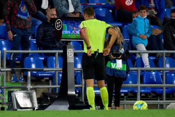 Referee Cuadra Fernandez cheking the VAR during the La Liga Santander match between Getafe CF and Club Atletico de Madrid at Coliseum Alfonso Perez...