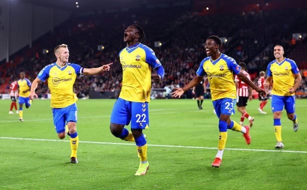 Mohammed Salisu of Southampton celebrates with James Ward-Prowse and Nathan Tella during the Carabao Cup Third Round match between Sheffield United...