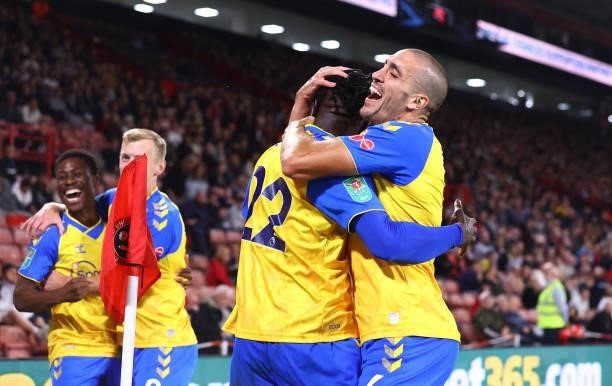Mohammed Salisu of Southampton is congratulated by Oriol Romeu during the Carabao Cup Third Round match between Sheffield United and Southampton at...