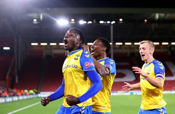 Mohammed Salisu of Southampton celebrates with Nathan Tella and James Ward-Prowse during the Carabao Cup Third Round match between Sheffield United...