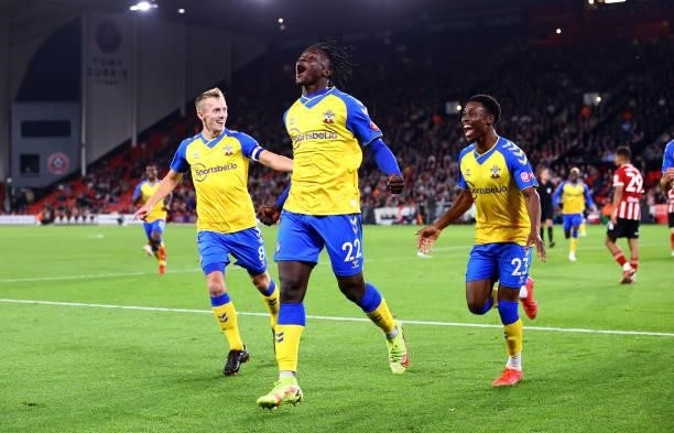 Mohammed Salisu of Southampton celebrates with James Ward-Prowse and Nathan Tella during the Carabao Cup Third Round match between Sheffield United...