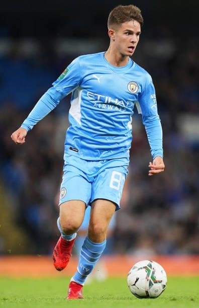 James McAtee of Manchester City runs with the ball during the Carabao Cup Third Round match between Manchester City and Wycombe Wanderers F.C. At...