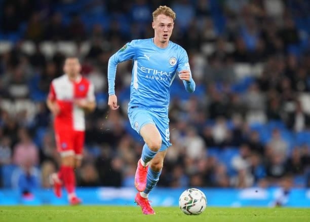Cole Palmer of Manchester City runs with the ball during the Carabao Cup Third Round match between Manchester City and Wycombe Wanderers F.C. At...