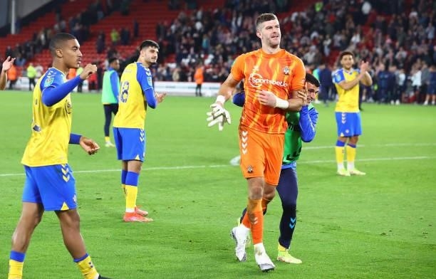 Fraser Forster of Southampton is congratulated by his team mates during the Carabao Cup Third Round match between Sheffield United and Southampton at...
