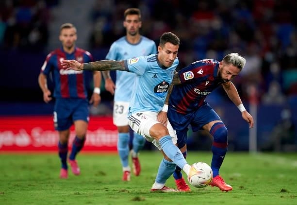 Jose Luis Morales of Levante UD competes for the ball with Hugo Mallo of RC Celta during the La Liga Santander match between Levante UD and RC Celta...