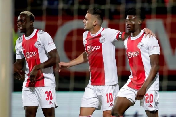 Mohamed Daramy of Ajax, Dusan Tadic of Ajax and Mohammed Kudus of Ajax celebrate their sides fourth goal during the Dutch Eredivisie match between...