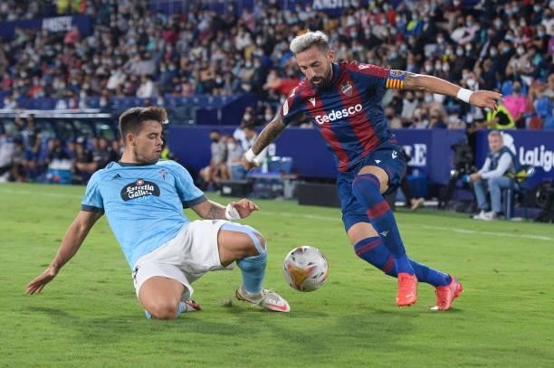 Jose Luis Morales of Levante is challenged by Fran Beltran of Celta Vigo during the La Liga Santander match between Levante UD and RC Celta de Vigo...