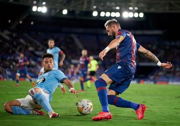 Jose Luis Morales of Levante UD competes for the ball with Fran Beltran of RC Celta during the La Liga Santander match between Levante UD and RC...