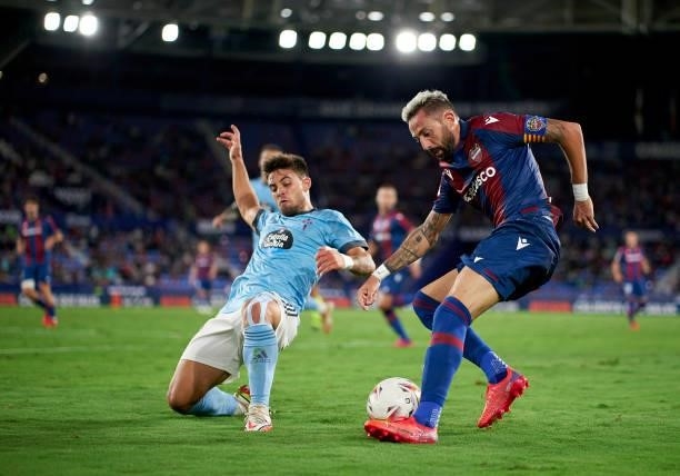 Jose Luis Morales of Levante UD competes for the ball with Fran Beltran of RC Celta during the La Liga Santander match between Levante UD and RC...