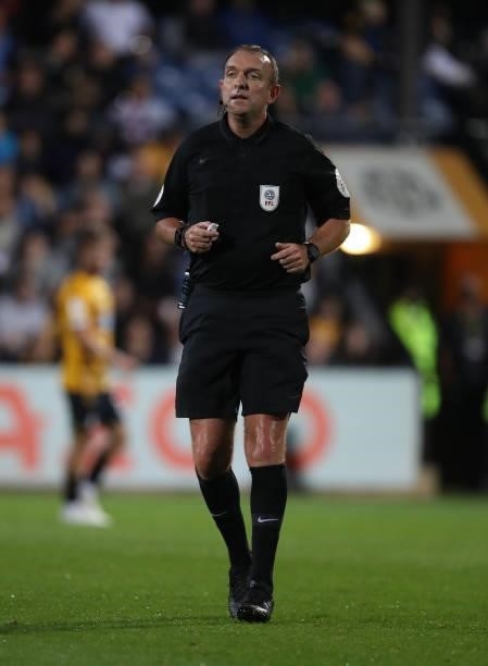 Referee Carl Boyeson in action during the Papa John's Trophy match between Cambridge United and Tottenham Hotspur U21 at Abbey Stadium on September...