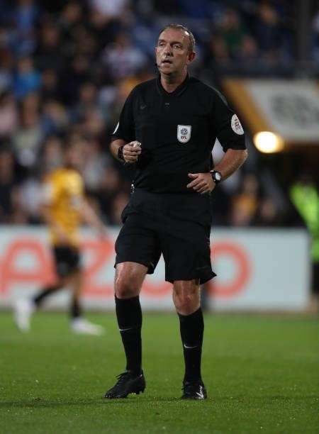 Referee Carl Boyeson in action during the Papa John's Trophy match between Cambridge United and Tottenham Hotspur U21 at Abbey Stadium on September...