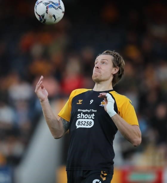 Joe Ironside of Cambridge United during the pre match warm up prior to the Papa John's Trophy match between Cambridge United and Tottenham Hotspur...