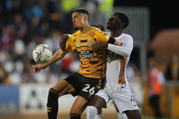 Harvey Knibbs of Cambridge United attempts to control the ball under pressure from Tobi Omole of Tottenham Hotspur U21during the Papa John's Trophy...