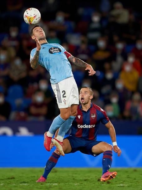 Eric Franquesa of Levante UD competes for the ball with Hugo Mallo of RC Celta during the La Liga Santander match between Levante UD and RC Celta de...