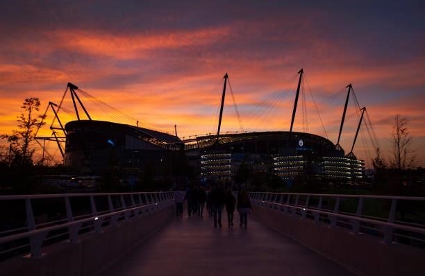 The sun sets behind the Etihad Stadium before the Carabao Cup Third Round match between Manchester City and Wycombe Wanderers F.C. At Etihad Stadium...