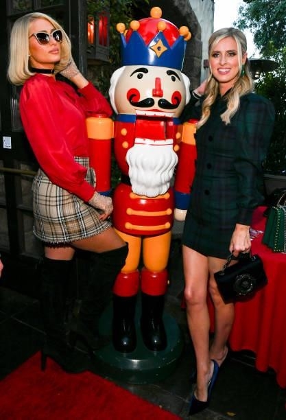 Paris Hilton and Nicky Hilton Rothschild pose for portrait at The Abbey's 16th annual Toy Drive for Children's Hospital LA at The Abbey Food & Bar on...