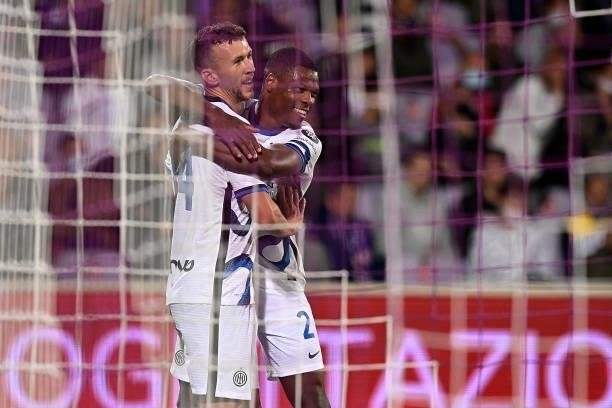Ivan Perisic of FC Internazionale celebrates with Denzel Dumfries of FC Internazionale second goal during the Serie A match between ACF Fiorentina v...