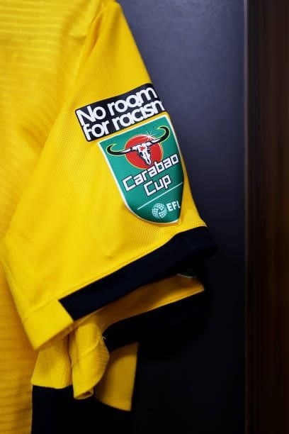 Detailed view of the Carabao Cup and No room for racism sleeve badge on the Wolverhampton Wanderers shirt inside the dressing room prior to the...