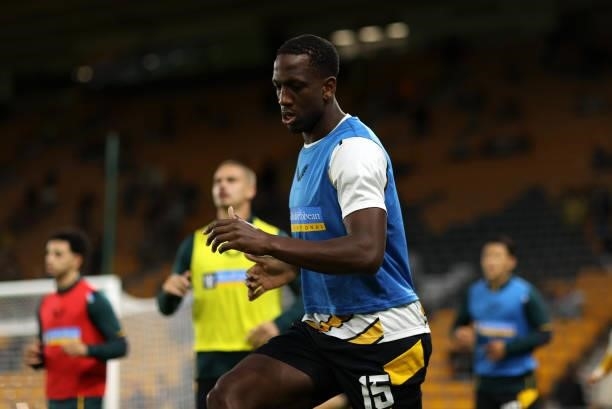 Willy Boly of Wolverhampton Wanderers warms up prior to the Carabao Cup Third Round match between Wolverhampton Wanderers and Tottenham Hotspur at...