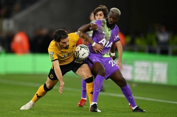 Ruben Neves of Wolverhampton Wanderers battles for possession with Tanguy Ndombele of Tottenham Hotspur during the Carabao Cup Third Round match...