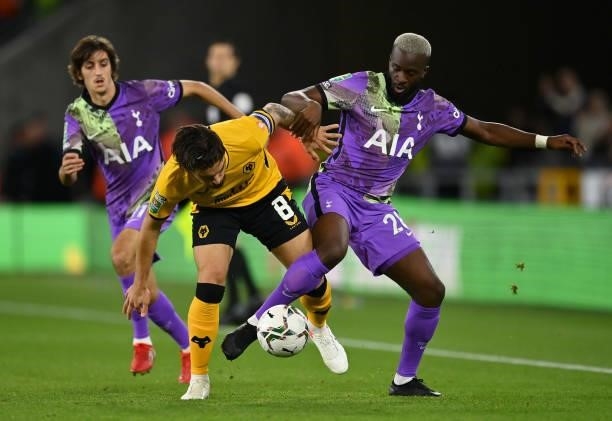 Ruben Neves of Wolverhampton Wanderers battles for possession with Tanguy Ndombele of Tottenham Hotspur during the Carabao Cup Third Round match...