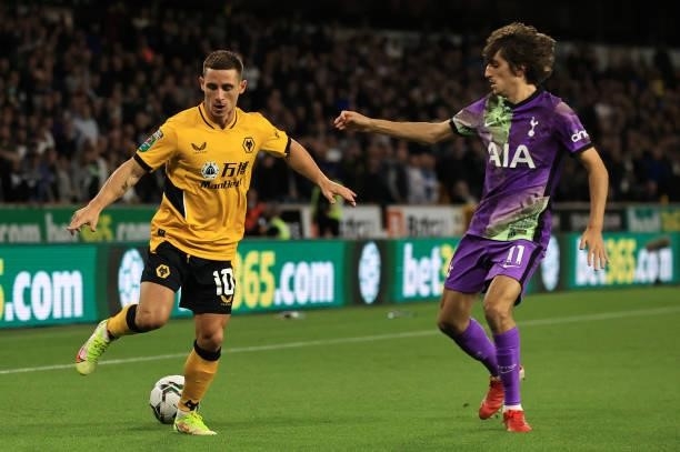 Daniel Podence of Wolverhampton Wanderers is closed down by Bryan Gil of Tottenham Hotspur during the Carabao Cup Third Round match between...