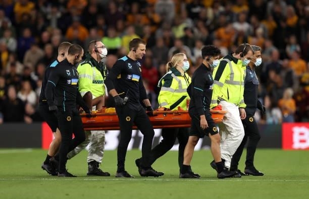 Yerson Mosquera of Wolverhampton Wanderers is stretchered off during the Carabao Cup Third Round match between Wolverhampton Wanderers and Tottenham...