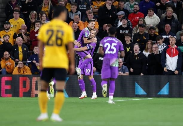 Harry Kane celebrates with Giovani Lo Celso and Japhet Tanganga of Tottenham Hotspur after scoring their team's second goal during the Carabao Cup...
