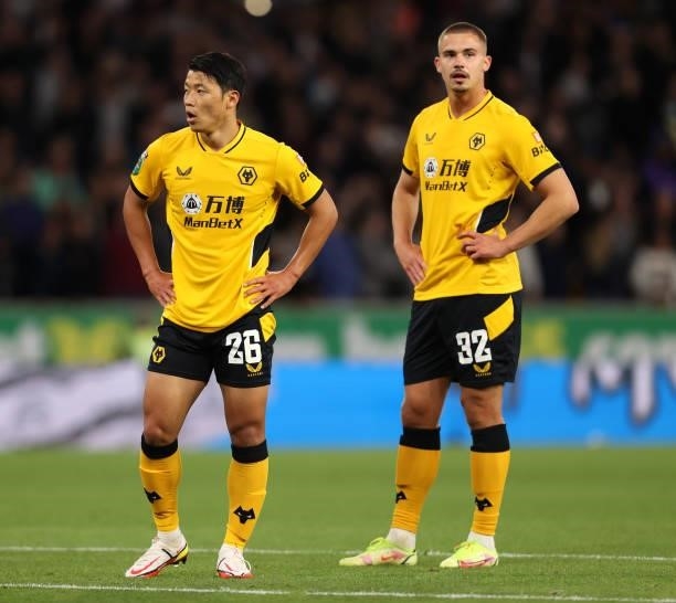 Hwang Hee-chan and Leander Dendoncker of Wolverhampton Wanderers look on during the Carabao Cup Third Round match between Wolverhampton Wanderers and...