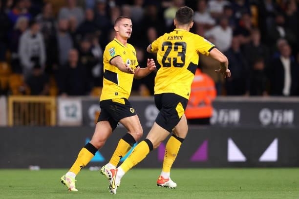Leander Dendoncker celebrates with Max Kilman of Wolverhamton Wanderers after scoring their team's first goal during the Carabao Cup Third Round...