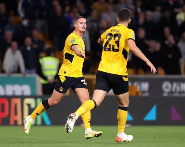 Leander Dendoncker celebrates with teammate Max Kilman of Wolverhamton Wanderers after scoring their team's first goal during the Carabao Cup Third...
