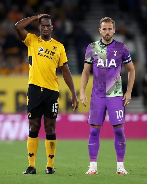 Willy Boly of Wolverhampton Wanderers reacts next to Harry Kane of Tottenham Hotspur during the Carabao Cup Third Round match between Wolverhampton...