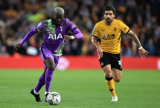 Tanguy Ndombele of Tottenham Hotspur battles for possession with Ruben Neves of Wolverhampton Wanderers during the Carabao Cup Third Round match...