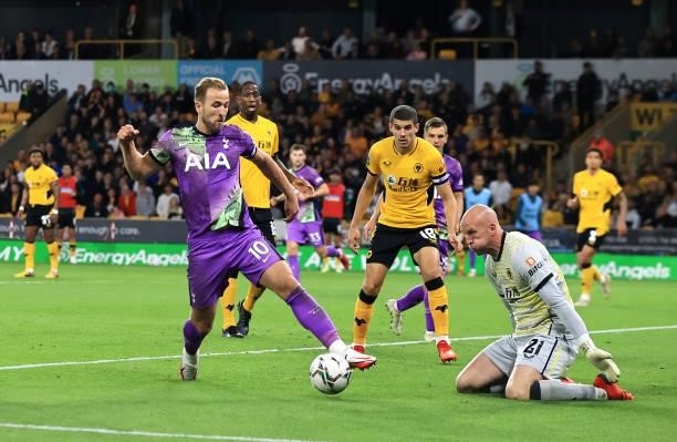 Harry Kane of Tottenham Hotspur looks to take the ball past John Ruddy of Wolverhampton Wanderers during the Carabao Cup Third Round match between...
